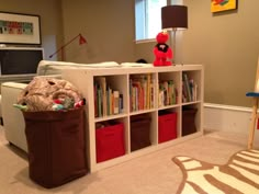 a living room filled with furniture and bookshelves