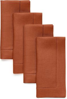 four orange napkins with stitching on each side and one folded in the middle