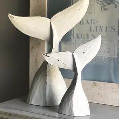 a white sculpture sitting on top of a shelf