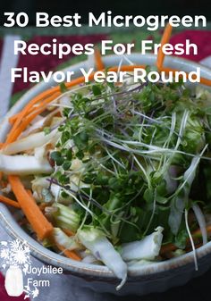 a bowl filled with lots of vegetables and sprouts on top of a table