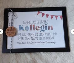 a framed sign with german words on it