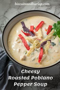 a bowl filled with soup and garnished with cilantro, red peppers and parsley