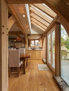 the inside of a house with wood floors and windows