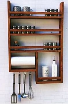 a wooden shelf filled with kitchen utensils