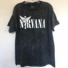 Nirvana In Utero Vintage Black Tee Shirt Faded Black T Shirt That Features Nirvanas Logo. Printed On A Washed Down Soft Garment - Mineral Washed Cotton In A Relaxed Fit. Vintage Logo Crew Neck Short Sleeves Brand New Officially Licensed Nirvana Vintage Black T Shirt Size Small Chest 18” Length 26” Size Medium Chest 20” Length 28” Size Large Chest 22” Length 29” Nirvana In Utero Vintage Black Graphic Tee Shirt Black Nirvana Shirt, Vintage Nirvana Shirt, Alternative Washed Black Short Sleeve Tops, Black Soft-washed T-shirt For Concert, Black Soft-washed Shirt For Summer, Oversized T-shirts, Graphic Tees Vintage Band Shirts, Alt Shirts, Nirvana Clothes