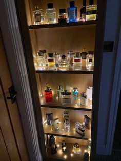 the shelves are filled with different types of perfumes