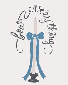 a candle with a blue ribbon around it and the words happy new year written in cursive writing