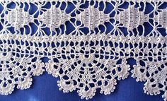 white crocheted lace on a blue background