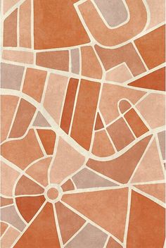 an orange and white rug with geometric shapes on it's sides, including the letter u