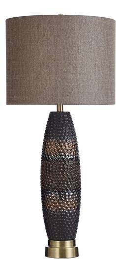 a table lamp with a brown shade on it