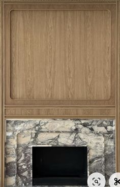 an image of a fireplace with marble and wood