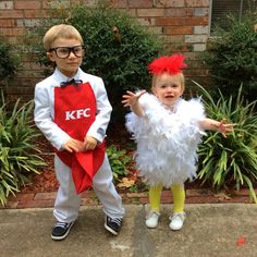 two young children dressed up in costumes