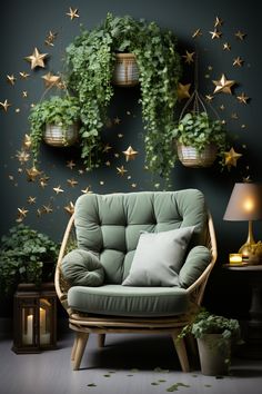 a green chair sitting in front of a wall with hanging plants and stars on it