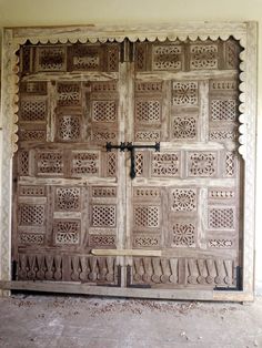 an old wooden door with intricate carvings on it