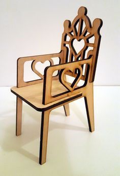 a chair made out of wood with a heart on the back and arms that are shaped like hearts