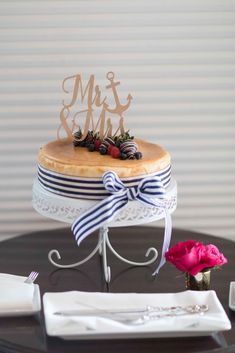 a cake with a name on it sitting on top of a table