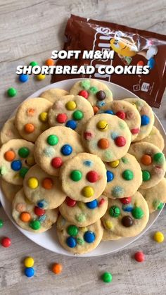 a white plate topped with m & m shortbread cookies