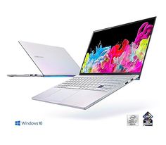 two laptops side by side one is white and the other is silver with colorful paint