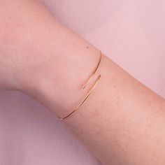 This trendy bracelet will bring a minimalist, modern, and fashionable touch to your look.Elegant and simple is a favorite piece and so easy to stack with other bracelets and bangles.Explore our collection of moden and classic bracelets for all the occasions. Home Page: https://www.etsy.com/shop/ByGema ♥♥Jewelry Certification Guarantee carats of products ♥♥ MATERIALS This piece of my Jewels Collection is made of 9 carats, 14 carats or 18 carats solid gold upon request. We like to use yellow gold, Adjustable Minimalist 14k Gold Bangle, Minimalist Adjustable Gold Bracelet, Minimalist Everyday Flexible Gold Bracelet, Everyday Minimalist Flexible Gold Bracelet, Minimalist Adjustable Gold Bracelet For Formal Occasions, Minimalist Flexible Bangle Bracelet, Minimalist Flexible Gold Bracelet, Minimalist Yellow Gold Cuff Bracelet, Minimalist Rose Gold Bracelet With Strap