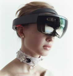 a woman wearing a pair of virtual glasses