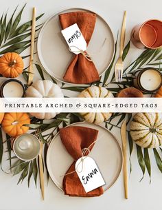 place setting with pumpkins, leaves and candles