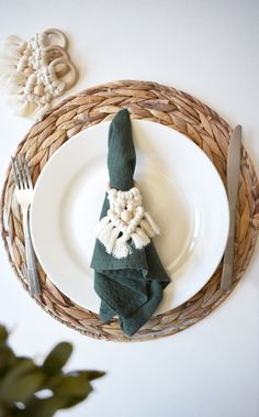 a white plate topped with a green napkin