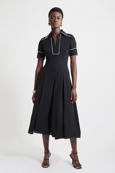 Feel Confident In Our Petite Midi Dress, With A Shirt Style Design Featuring A Formal Collar, And A Long, Flared Skirt. Style It With Block Heels Or Ankle Boots For A Look Perfect For Office Days, Then Wear It With Heeled Boots Or Strappy Heels For An Evening Look. Fluid Tailored Tipped Full Skirted Midi Dress Flattering Fit And Flare Silhouette Unique Contrasting Trim Details High Neckline Unique Collar Detailing Relaxed, Flared Skirt Zip Front Fastening Modest Midi Dress Formal, Bride Jumpsuit, Petite Wedding Guest Dresses, Long Flared Skirt, Petite Midi Dress, Plus Size Workwear, Summer Bridesmaid Dresses, Italy Outfits, Outfits Petite