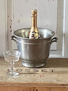 French pewter champagne bucket. A beautiful piece in excellent vintage condition. This lovely cooler is in a bucket shape and features wonderful craftsmanship, roomed handles with embossed detailing as well as a design band around the circumference in relief . The cooler is stamped on the underside with makers marks and pewter authenticity stamps. The cooler has been very well cared for, no dents and no major scratches, just some micro rayures. The handles have a lovely patina. A lovely example Chic Shopping Bucket Bag With Silver-tone Hardware, Champagne In Ice Bucket, Large Silver Champagne Buckets, Luxury Silver Bucket Bag With Silver-tone Hardware, Vintage Bucket, Champagne Cooler, Vintage Silver Champagne Bucket, French Lifestyle, Vintage Champagne