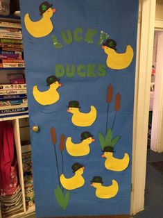 a door decorated with rubber ducks for st patrick's day celebrations, and the words lucky ducks written on it