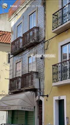 an old building with balconies on the second floor