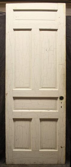 an old white door with no glass on it