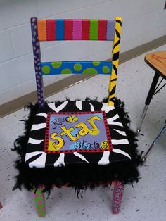 a zebra print chair with the number twenty five on it's back and seat cover