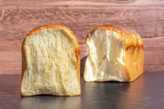 a piece of bread that has been cut in half and is sitting on a table