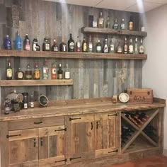 a wooden bar with lots of bottles on it