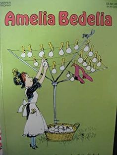 an old children's book with the title amelia bedella hanging on a clothes line