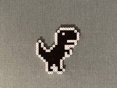 a black and white sticker with the word dino on it's back side