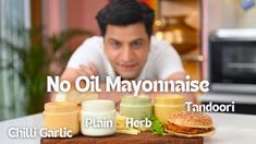 a man sitting at a table with some food on it and the words no oil mayonnaise above him