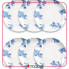 four plates with blue flowers on them and one plate has three smaller plates next to it