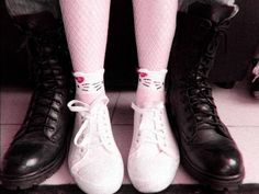 two pairs of black and white shoes with pink socks