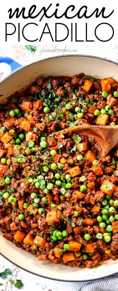 mexican picadillo with peas and carrots in a skillet on a table