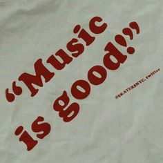 a white t - shirt with red lettering that says music is good