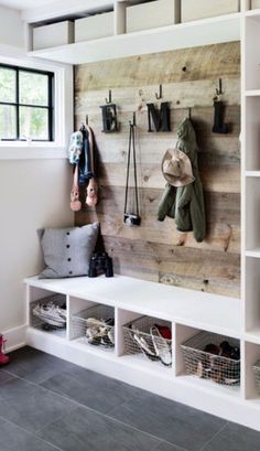 a room with some shelves and baskets on the wall