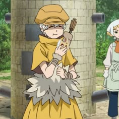 two anime characters are standing in front of a brick wall and one is holding an object