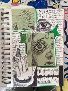 an open notebook with drawings and words on the pages, including one eye looking at someone's hand