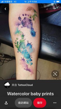 watercolor tattoos on the leg of a woman's left arm and foot, with flowers