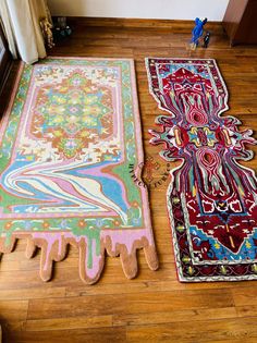 two rugs are laying on the floor next to each other