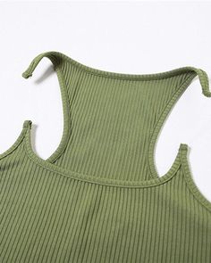 Details: Cami top with sabertooth-like designTop Length: NormalSleeve Length: SleevelessMaterials:95% Polyester + 5% Spandex Green Vest Tops With Tank Straps, Green Racerback Vest Top, Green Stretch Crop Top With Tank Straps, Green High Stretch Sleeveless Tops, Solid Color High Stretch Tops With Tank Straps, Green Casual High Stretch Tank Top, Casual High-stretch Green Tank Top, Green Stretch Racerback Tops, Skirt Heels