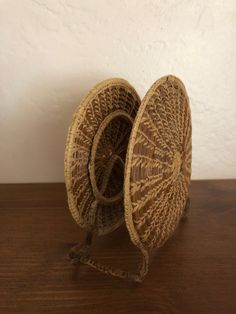 two baskets sitting on top of a wooden table