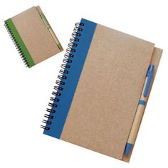 two notebooks and pen sitting next to each other