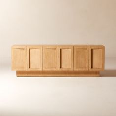 a wooden cabinet sitting on top of a white floor